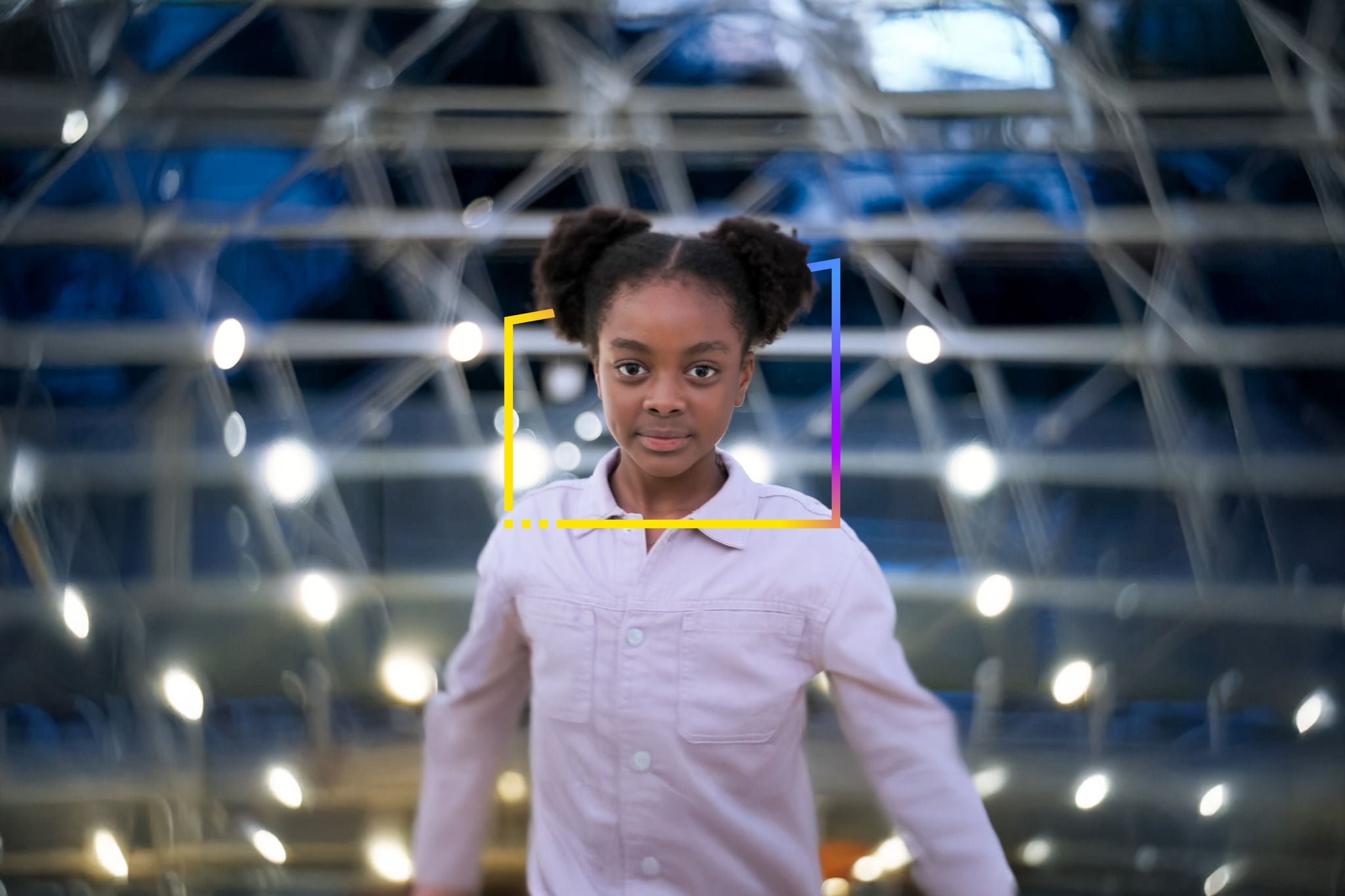 Photo of a girl standing in front of a building